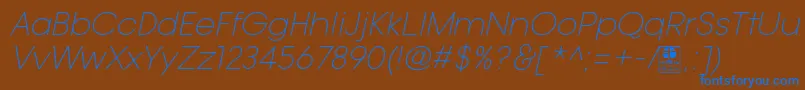 TypoGotikaLightItalicDemo-fontti – siniset fontit ruskealla taustalla