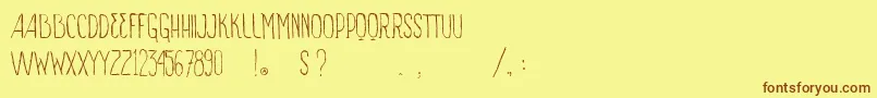 フォントVtksSignOfTimes – 茶色の文字が黄色の背景にあります。