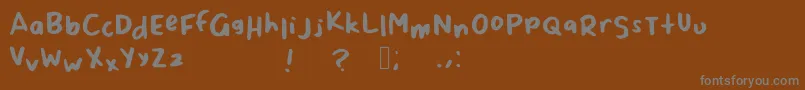 Шрифт ScrappyLeDoot – серые шрифты на коричневом фоне