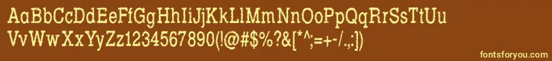 RowdyTypemachine5CondensedRegular-fontti – keltaiset fontit ruskealla taustalla