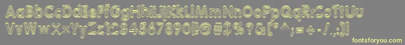 TeazerNormal Font – Yellow Fonts on Gray Background