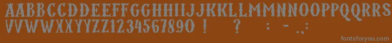 フォントKordes – 茶色の背景に灰色の文字