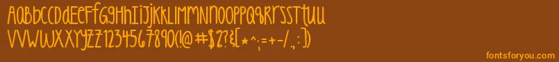 Kgluckoftheirish Font – Orange Fonts on Brown Background