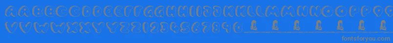 CookieDough-Schriftart – Graue Schriften auf blauem Hintergrund