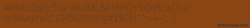 Шрифт UniversNextProUltralightCondensed – чёрные шрифты на коричневом фоне