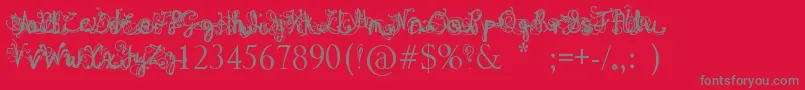 DenneAngel-Schriftart – Graue Schriften auf rotem Hintergrund