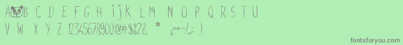 フォントScreamyhand – 緑の背景に灰色の文字