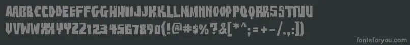 BuzzsawChippedAoe-Schriftart – Graue Schriften auf schwarzem Hintergrund