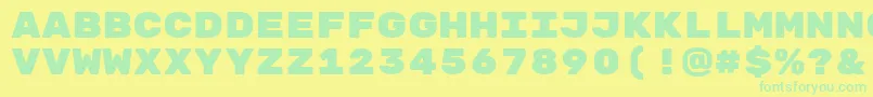 RubikmonooneRegular-Schriftart – Grüne Schriften auf gelbem Hintergrund