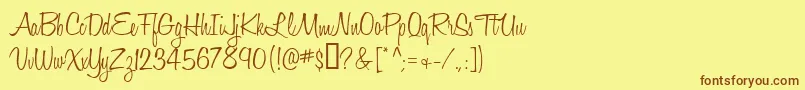 フォントHoneyscript – 茶色の文字が黄色の背景にあります。