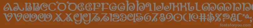 フォントTheshireb – 茶色の背景に灰色の文字