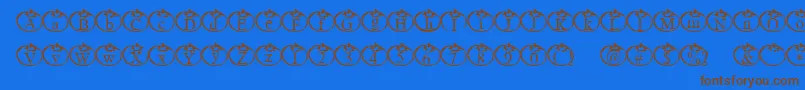 Tomate Font – Brown Fonts on Blue Background