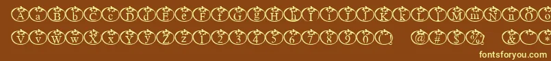 Tomate-fontti – keltaiset fontit ruskealla taustalla