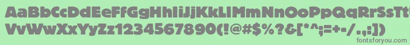 Blocheavyc Font – Gray Fonts on Green Background