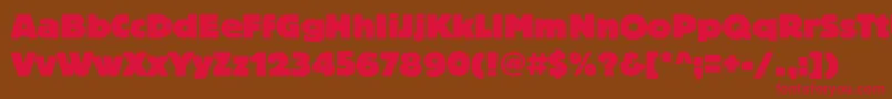 フォントBlocheavyc – 赤い文字が茶色の背景にあります。