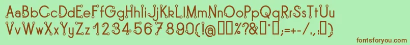 TipoisRegular-fontti – ruskeat fontit vihreällä taustalla