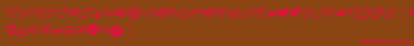 Czcionka Mwheart – czerwone czcionki na brązowym tle