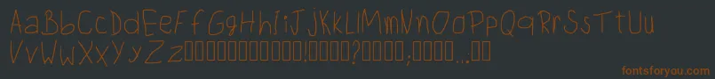 フォントChildwritingRegular – 黒い背景に茶色のフォント