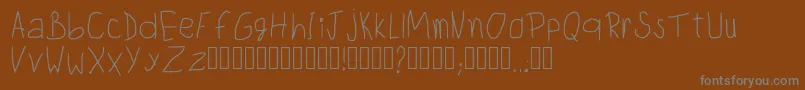 ChildwritingRegular-Schriftart – Graue Schriften auf braunem Hintergrund