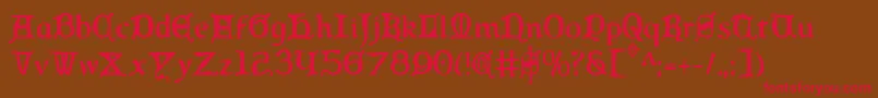 フォントQueencountryc – 赤い文字が茶色の背景にあります。
