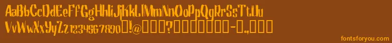 フォントMotrg – オレンジ色の文字が茶色の背景にあります。