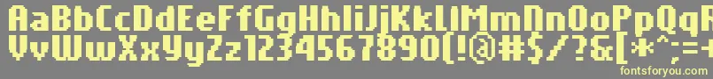 PfTempestaSevenCompressedBold Font – Yellow Fonts on Gray Background