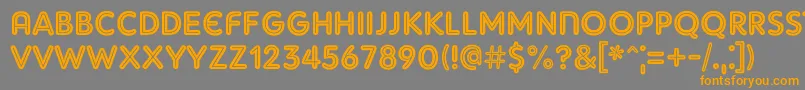 フォントAdamGorryInline – オレンジの文字は灰色の背景にあります。