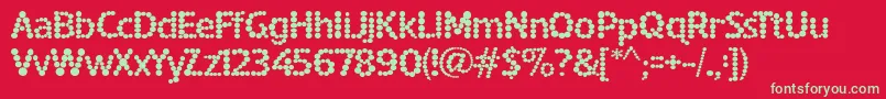 SpottedFever-Schriftart – Grüne Schriften auf rotem Hintergrund