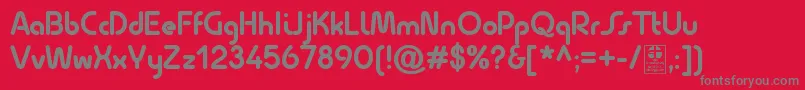 QuesatBoldDemo-fontti – harmaat kirjasimet punaisella taustalla