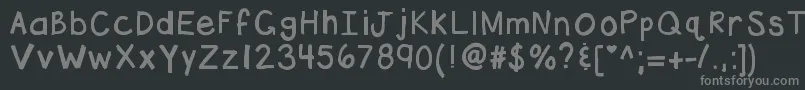 フォントKbhottamale – 黒い背景に灰色の文字
