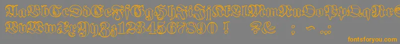 フォントProclamateOutline – オレンジの文字は灰色の背景にあります。