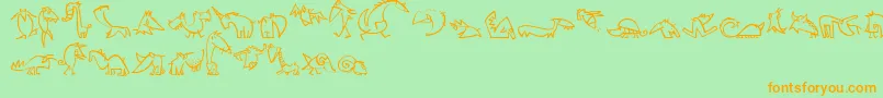 CreaturesLt-Schriftart – Orangefarbene Schriften auf grünem Hintergrund