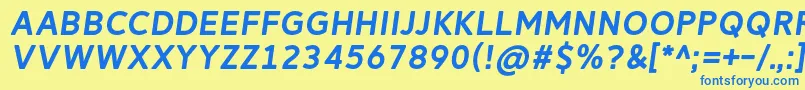 フォントReitamRegularItalic – 青い文字が黄色の背景にあります。