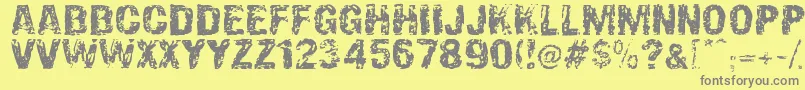 Fonte OverprintDsg – fontes cinzas em um fundo amarelo