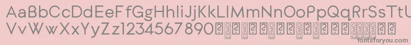 DylangothicRegular-fontti – harmaat kirjasimet vaaleanpunaisella taustalla