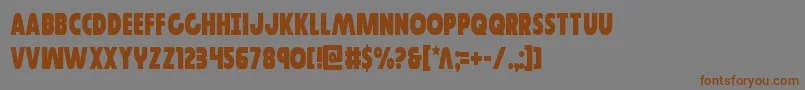 フォントGovernorcond – 茶色の文字が灰色の背景にあります。