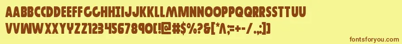 フォントGovernorcond – 茶色の文字が黄色の背景にあります。