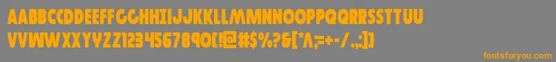 フォントGovernorcond – オレンジの文字は灰色の背景にあります。