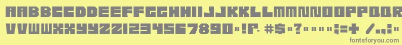 フォントEtcher04i – 黄色の背景に灰色の文字