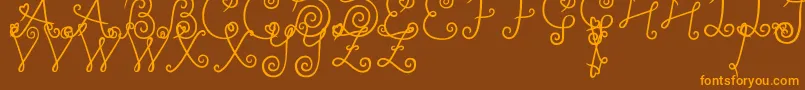 YleeDalkomRollCake Font – Orange Fonts on Brown Background