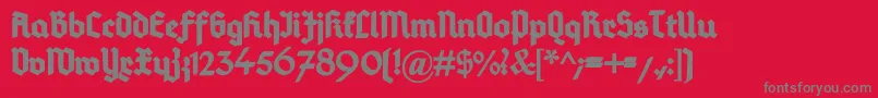 DeutschGotischHeavy-Schriftart – Graue Schriften auf rotem Hintergrund