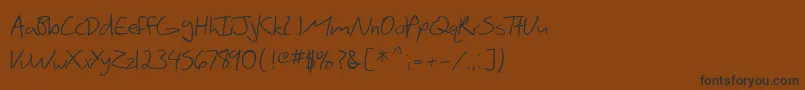SfScribbledSans Font – Black Fonts on Brown Background