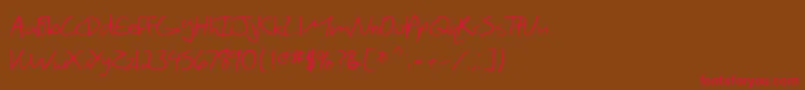 フォントSfScribbledSans – 赤い文字が茶色の背景にあります。