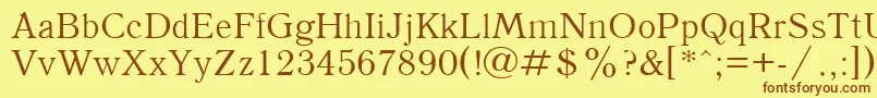 フォントAntiqua105n – 茶色の文字が黄色の背景にあります。