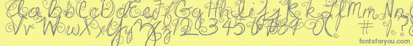 DjbSwirlMeAround-fontti – harmaat kirjasimet keltaisella taustalla