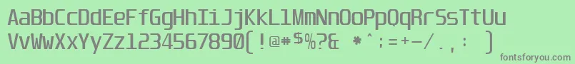 フォントUnispace – 緑の背景に灰色の文字