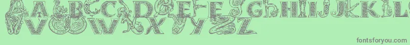 フォントCeltasmigoria – 緑の背景に灰色の文字
