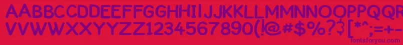Czcionka ComickbookCaps – fioletowe czcionki na czerwonym tle