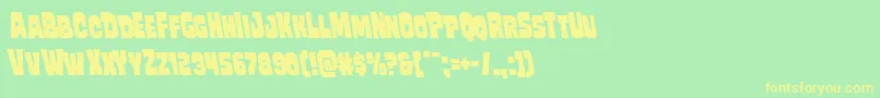 フォントMindlessbruteleft – 黄色の文字が緑の背景にあります