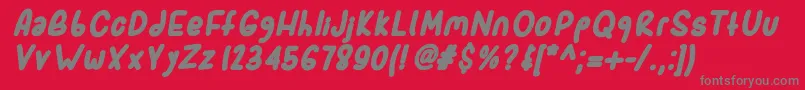 Sporkbolditalic-fontti – harmaat kirjasimet punaisella taustalla
